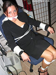 Office lady is tied up helplessly in her suit and high heels