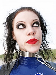 Latex slut is put on all fours, ball gagged, cuffed, put on a leash and then taken for a walk